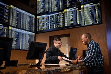 man at a sportsbook explaining sports betting basics